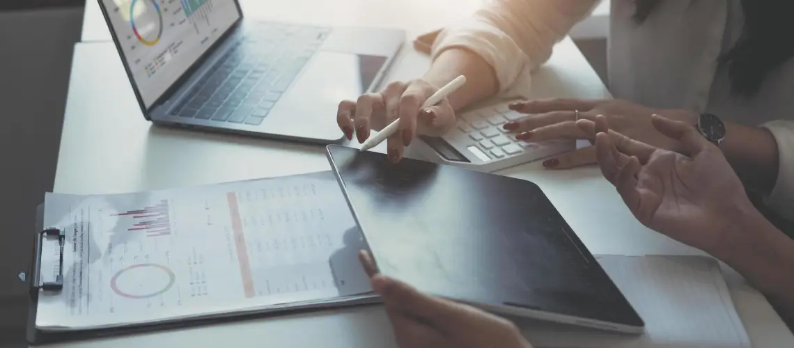 Canberra business owner with certified valuer reviewing financials